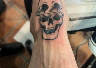 Skull Ripple Tattoo